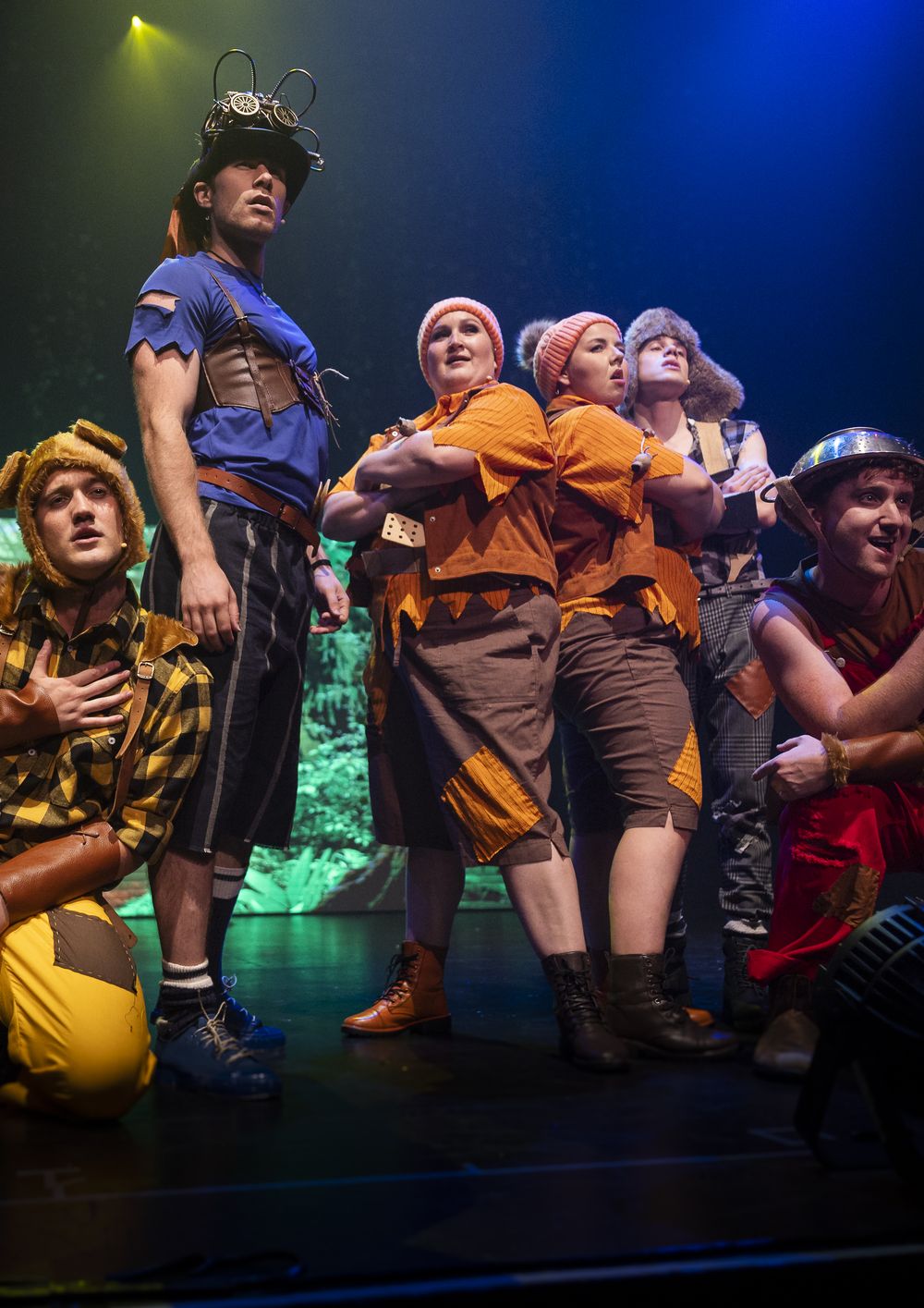 A group of cast members in costume on stage in Zealous Productions' Peter Pan pantomime, Regal Theatre Perth, December 2022