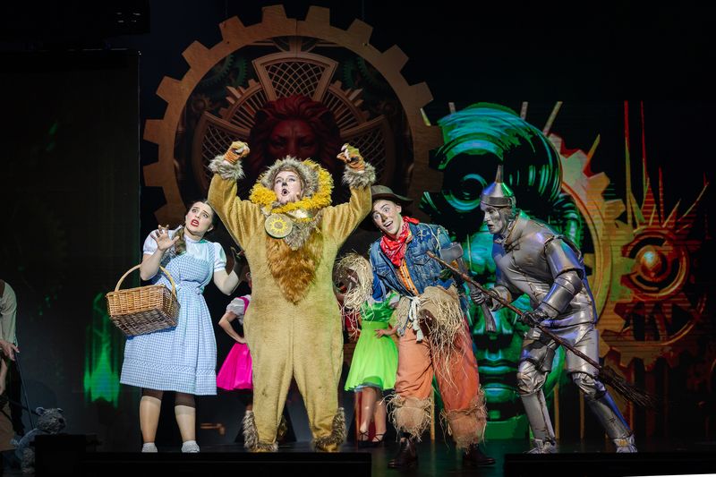 Dorothy, the Cowardly Lion, the Scarecrow and the Tin Man on stage, The Wizard of Oz pantomime by Zealous Productions, December 2025